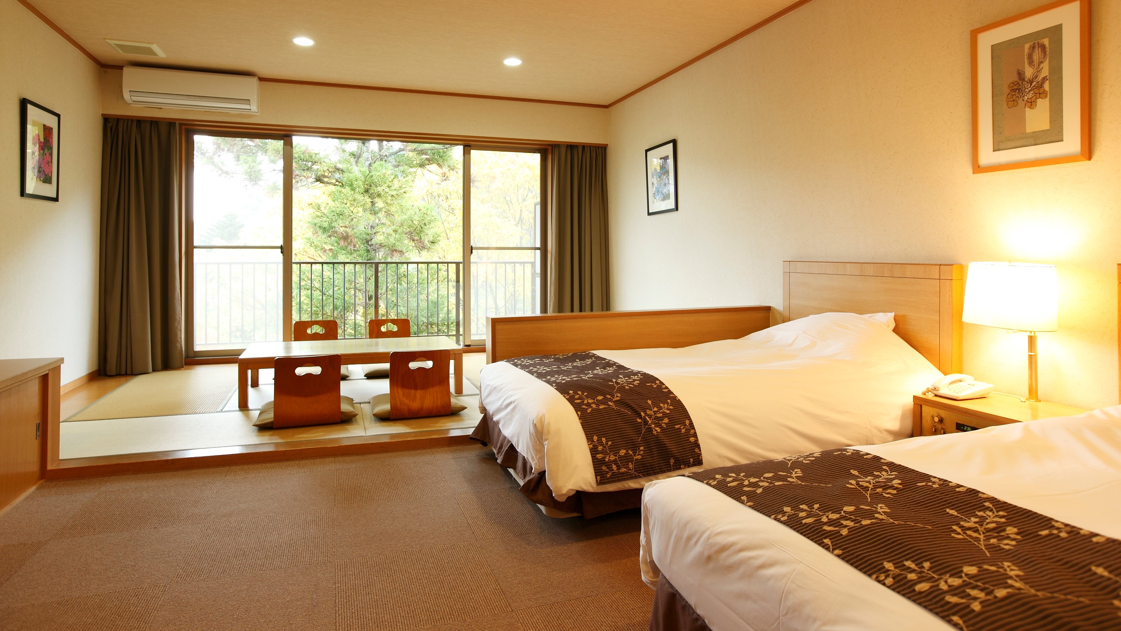 Equipped with two tall beds, you can spend a relaxing time.
