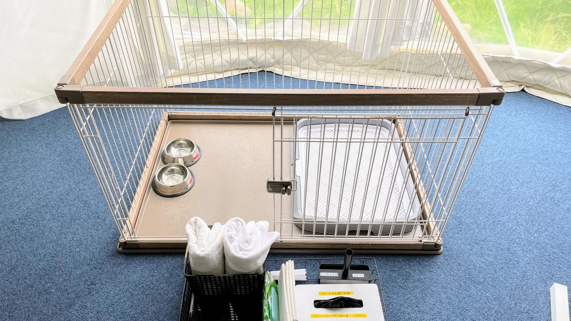 Pet cages are provided inside the tent