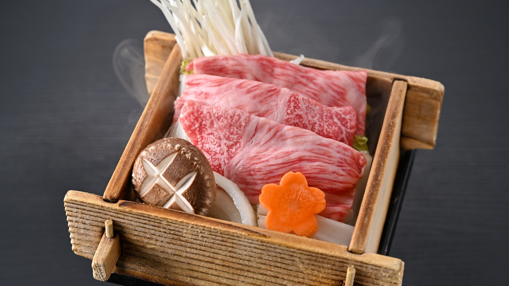 Saga beef and seasonal vegetables steamed in a bamboo steamer