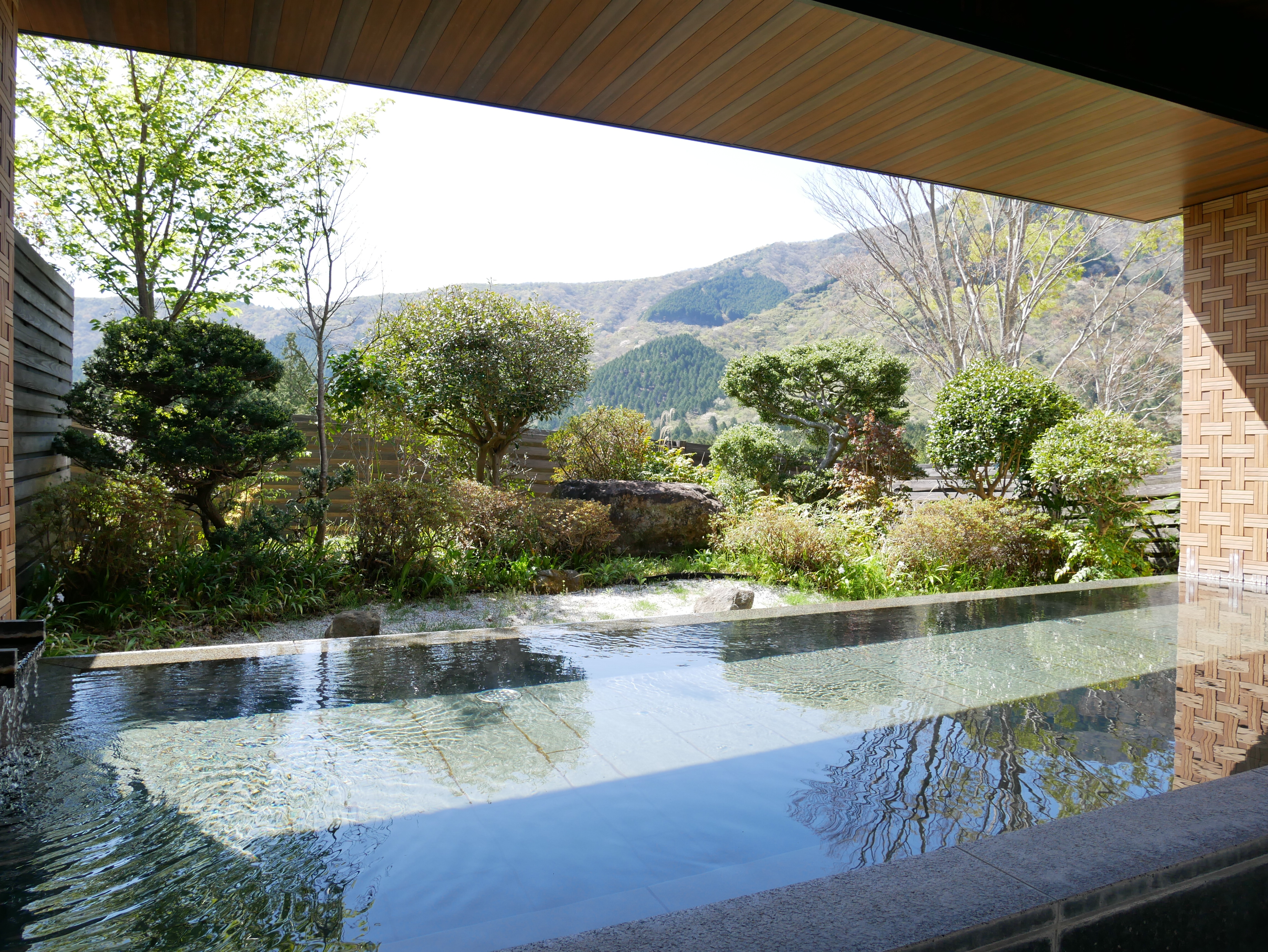 An open-air hot spring bath with a view of the Hakone Somma