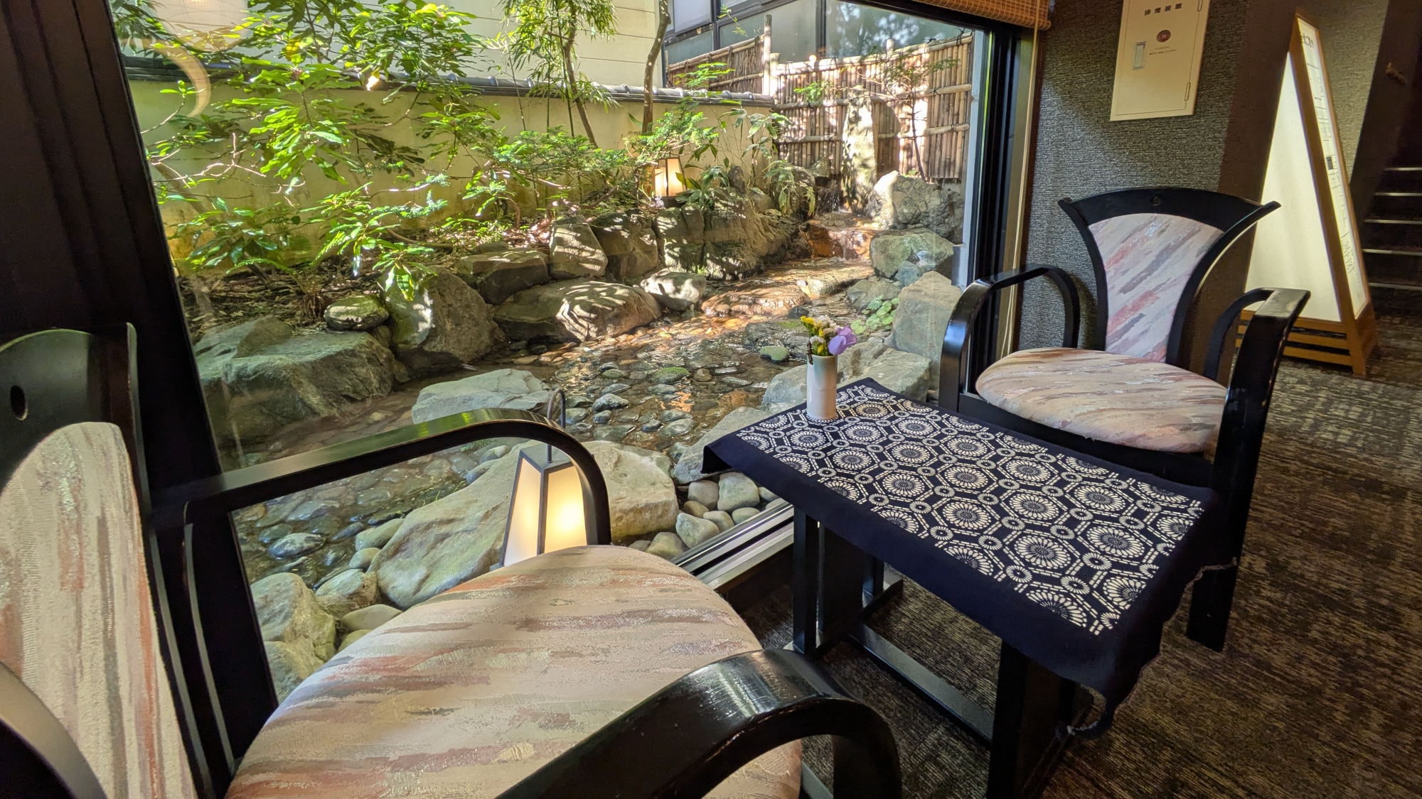 A quiet lobby overlooking the hotel's garden.