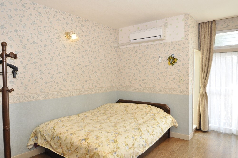 Double type guest room. This plan offers a bright corner room with natural lighting from two sides.
