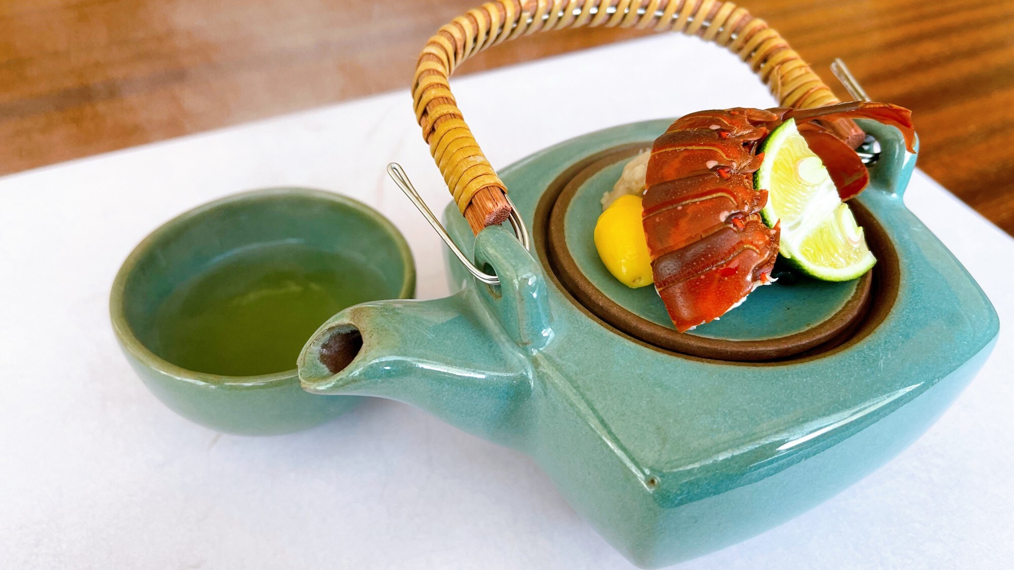 Image of earthenware pot with spiny lobster