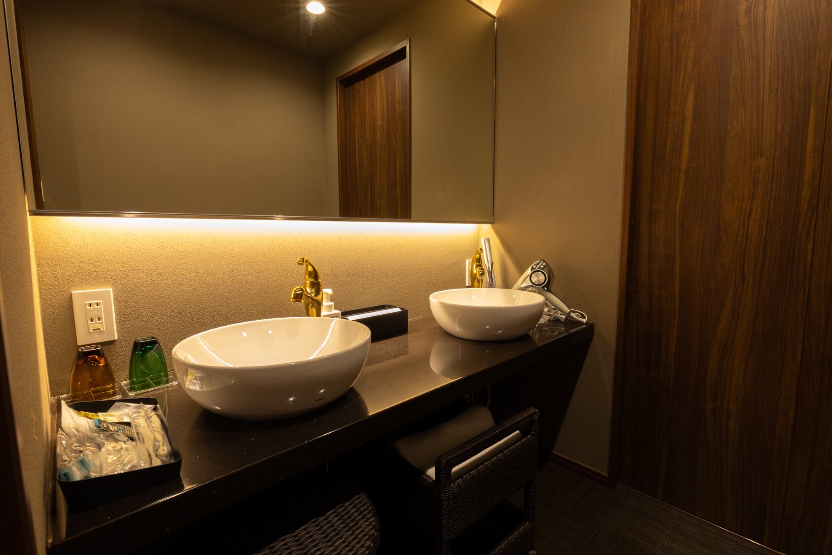 A modern Japanese twin room with an open-air bath. A "Velvet" powder room.