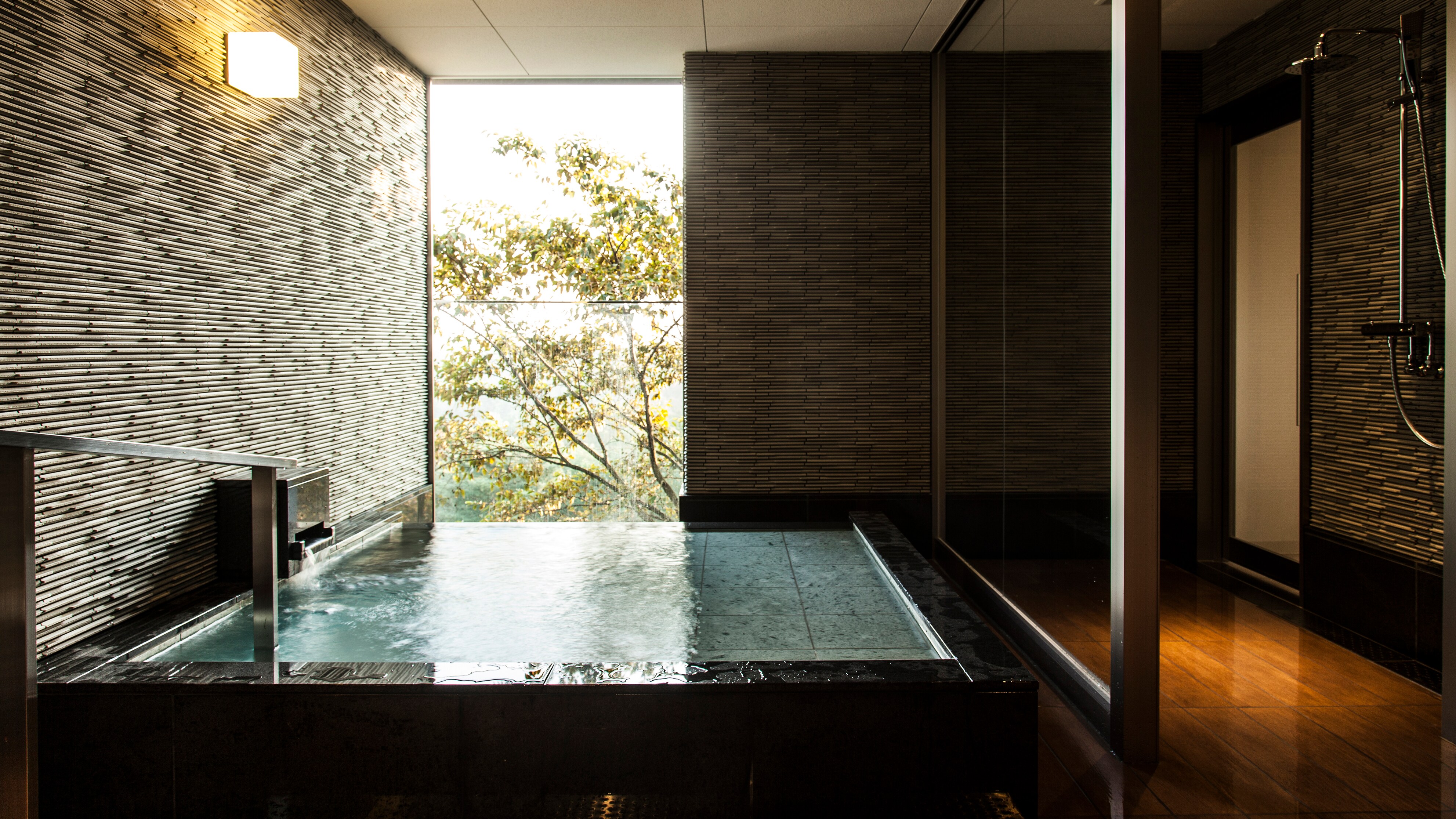 Semi-open-air hot spring suite with panoramic view
