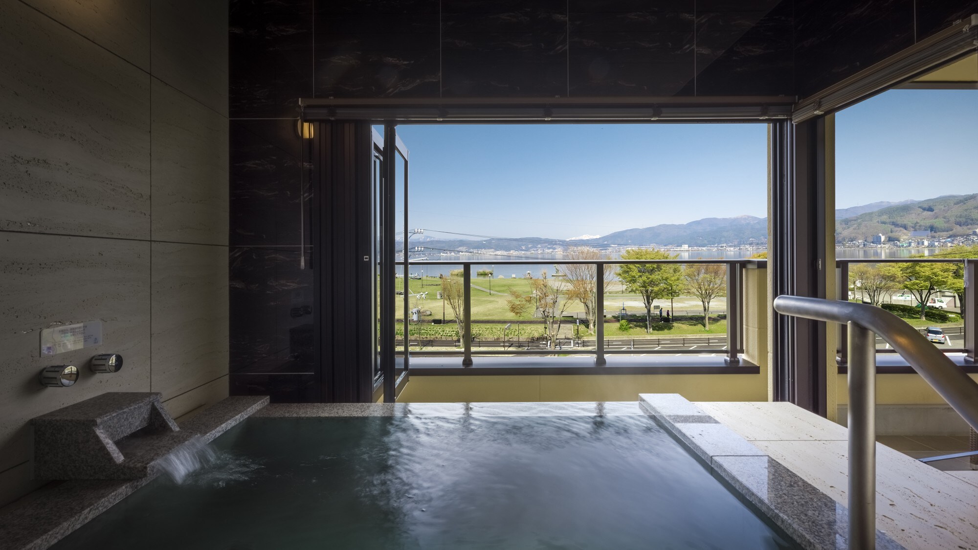 Open-air baths in guest rooms. All rooms have open-air baths. You can see Lake Suwa from the open-air hot spring baths in your room.