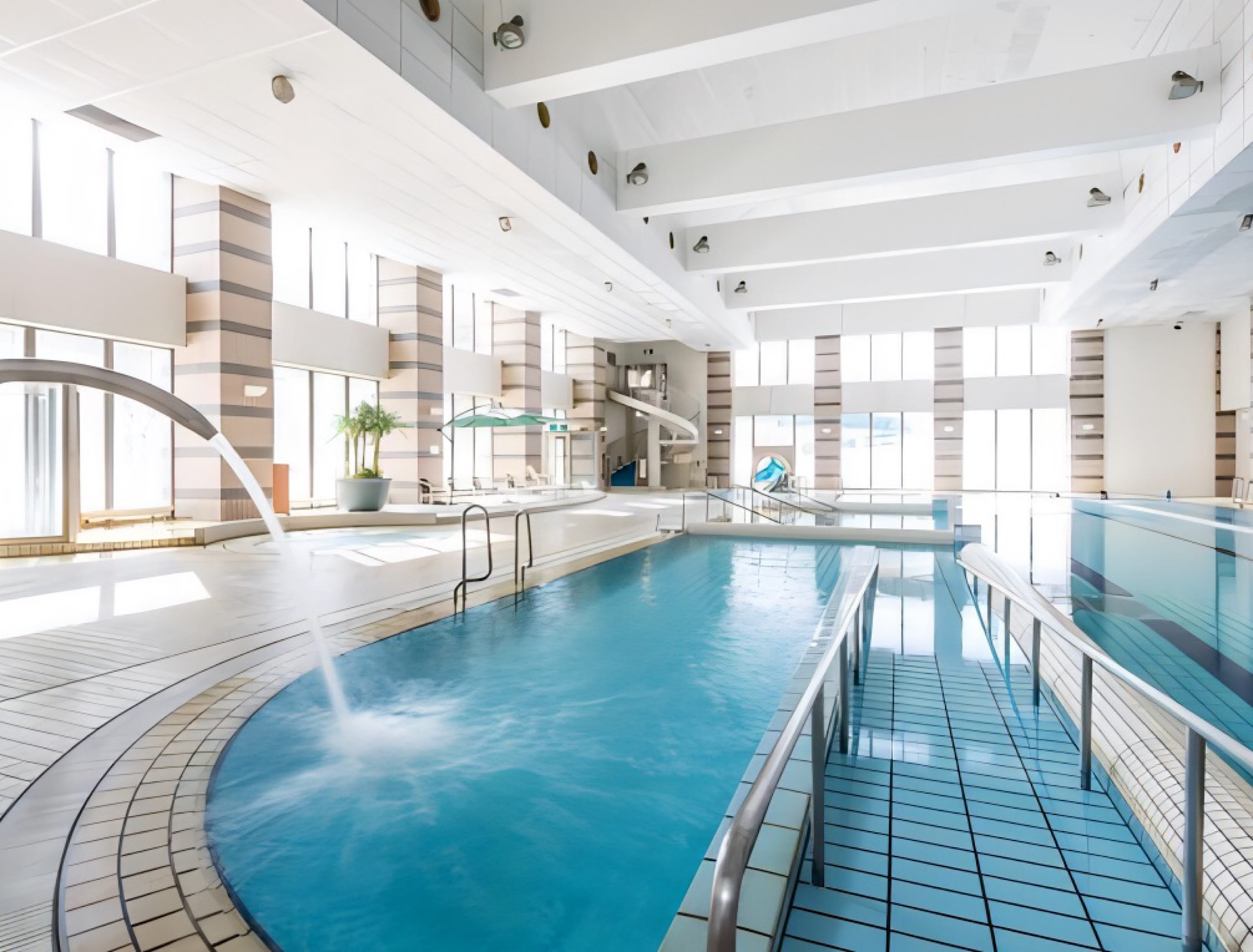 Swim all year round! A heated indoor pool with a slide. Check out the limited-time night pool below!