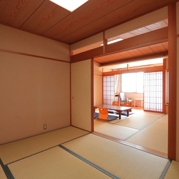 A spacious Japanese-style room with two adjacent rooms