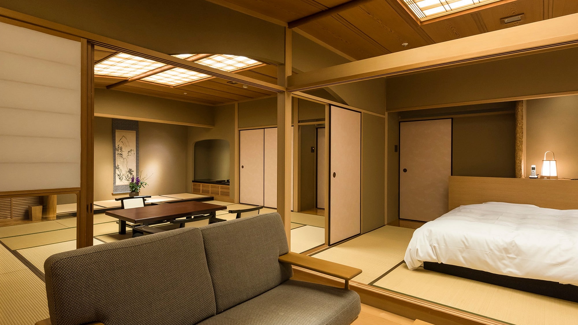 Japanese-Western style room with open-air garden bath-A spacious floor plan with twin beds and a living room.