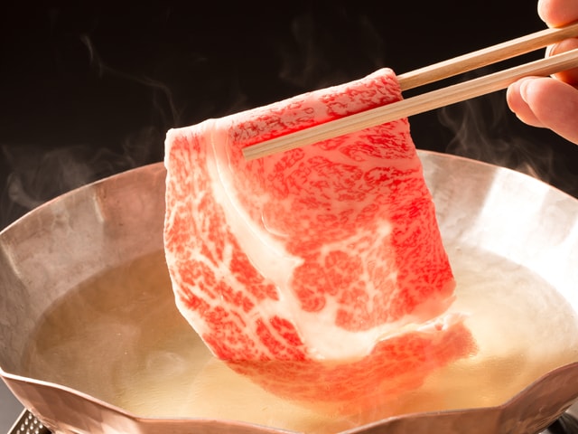 A bite of marbled meat cut into a large size