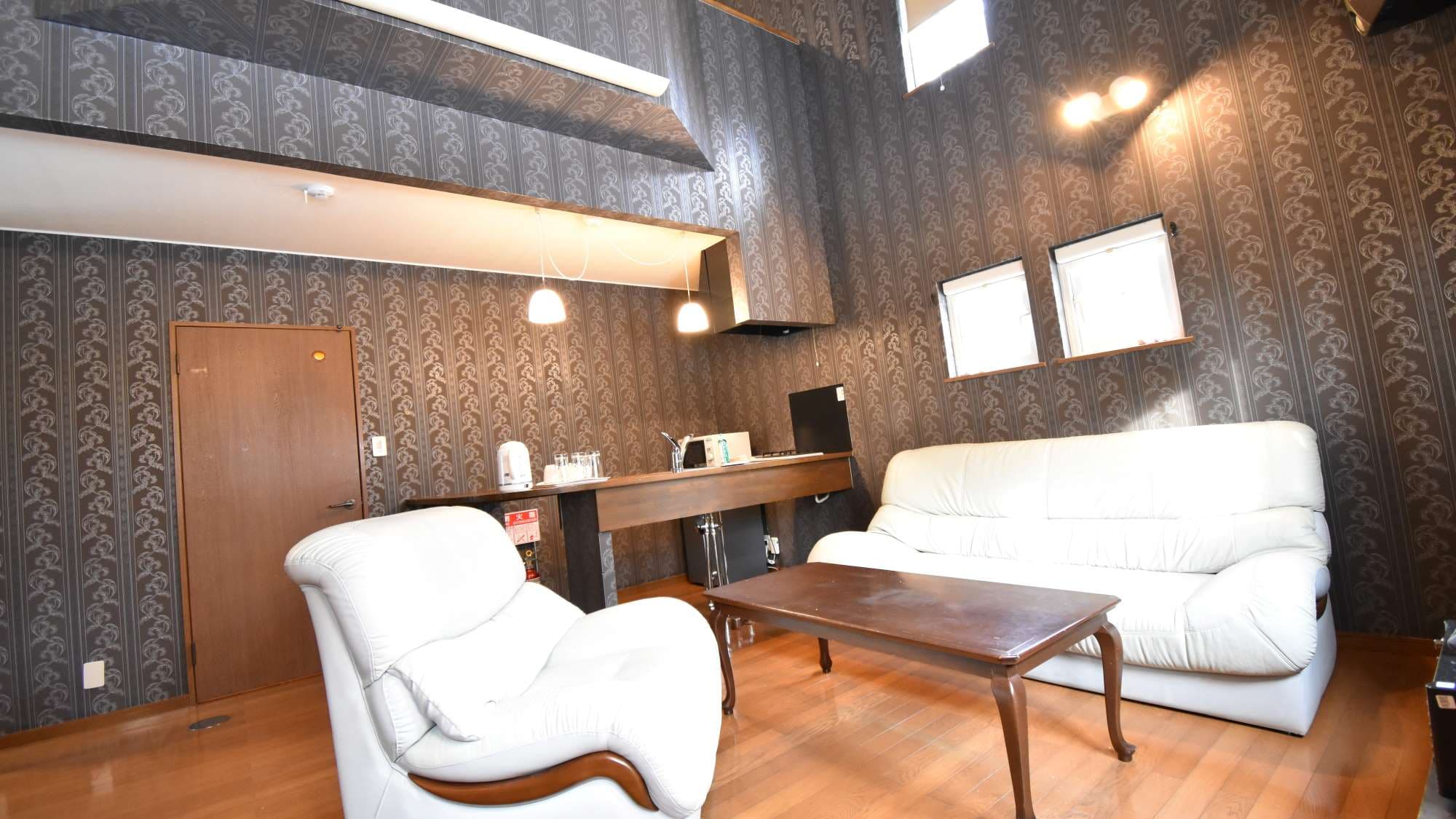 ・Family A: The living room is equipped with a sofa and a dining table.