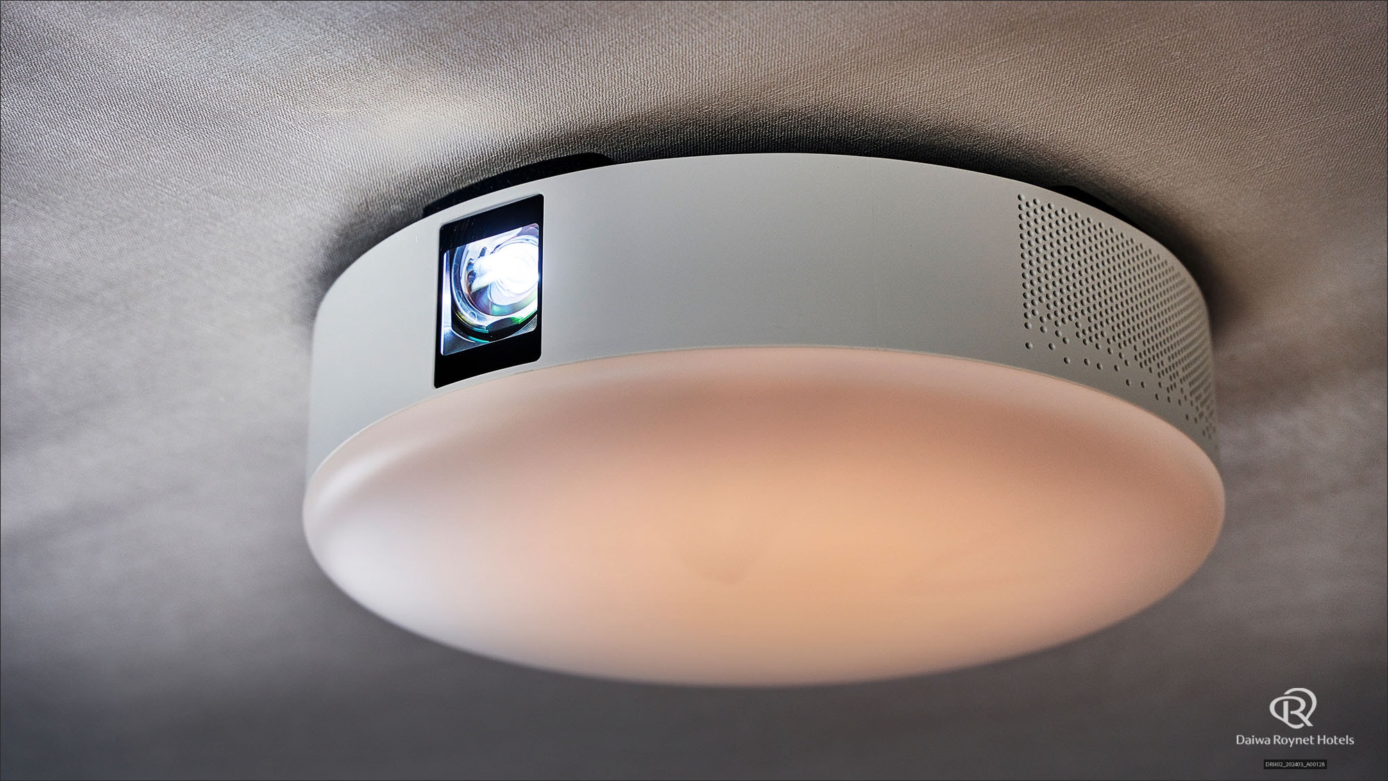 Home projector with integrated lighting *Installed only in compact twin rooms
