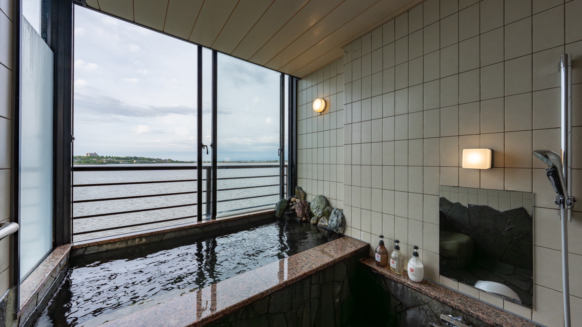 ■ Standard Japanese-style room with private hot spring rock bath and lakeside view