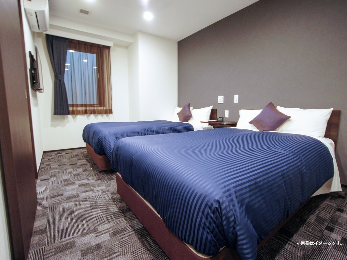 Kamar Twin Semua kamar dilengkapi dengan tempat tidur slumberland.