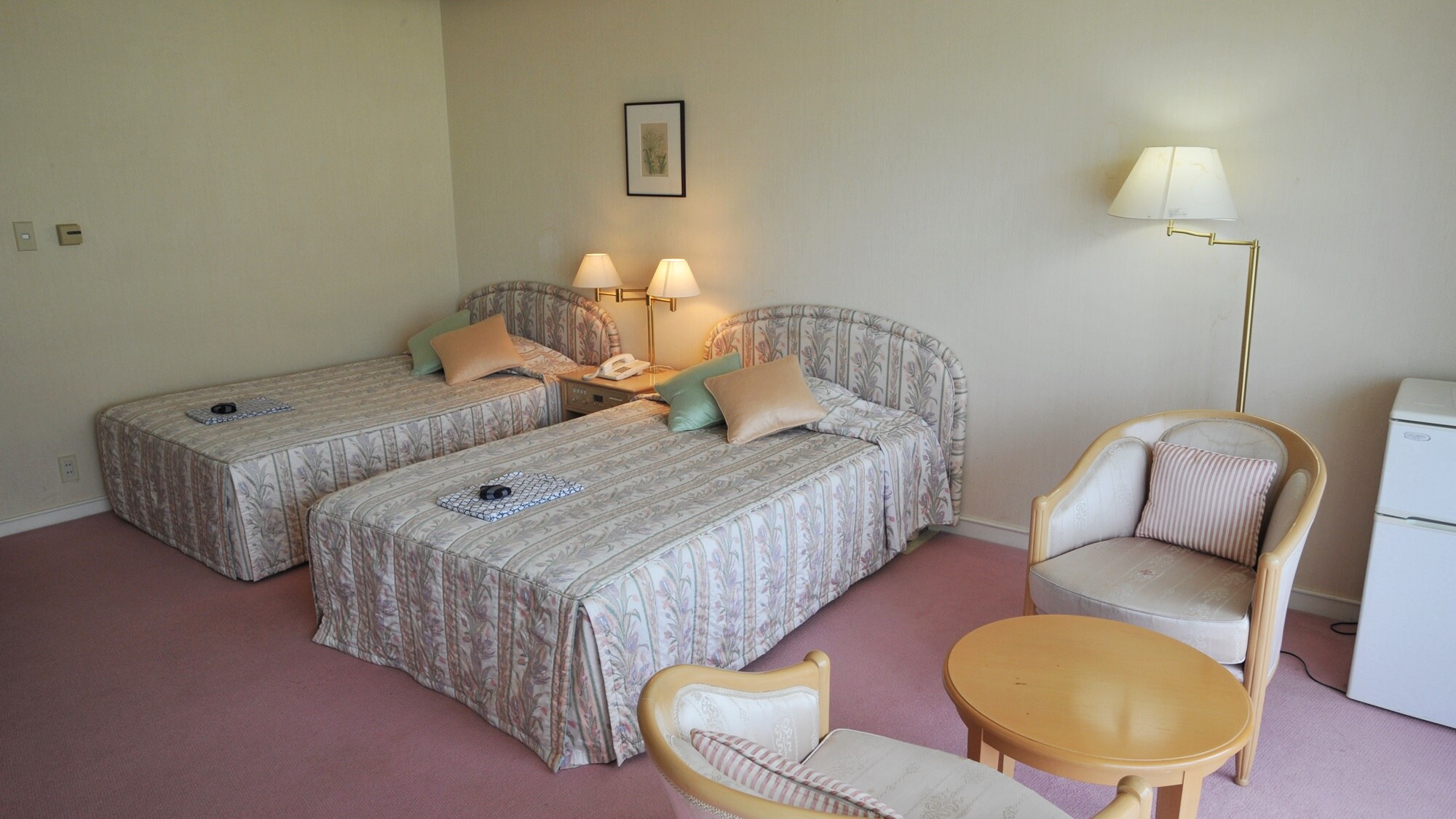 * An example of a twin room. The interior is unified with soft tones, which is popular with female customers.