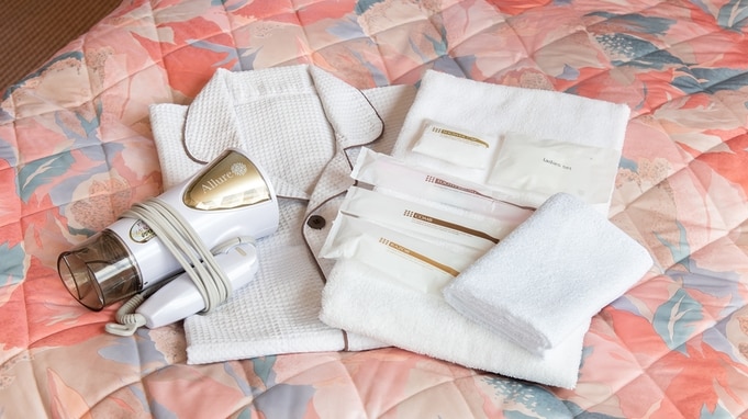 *[An example of a guest room] Amenities and gowns are provided in the guest room.