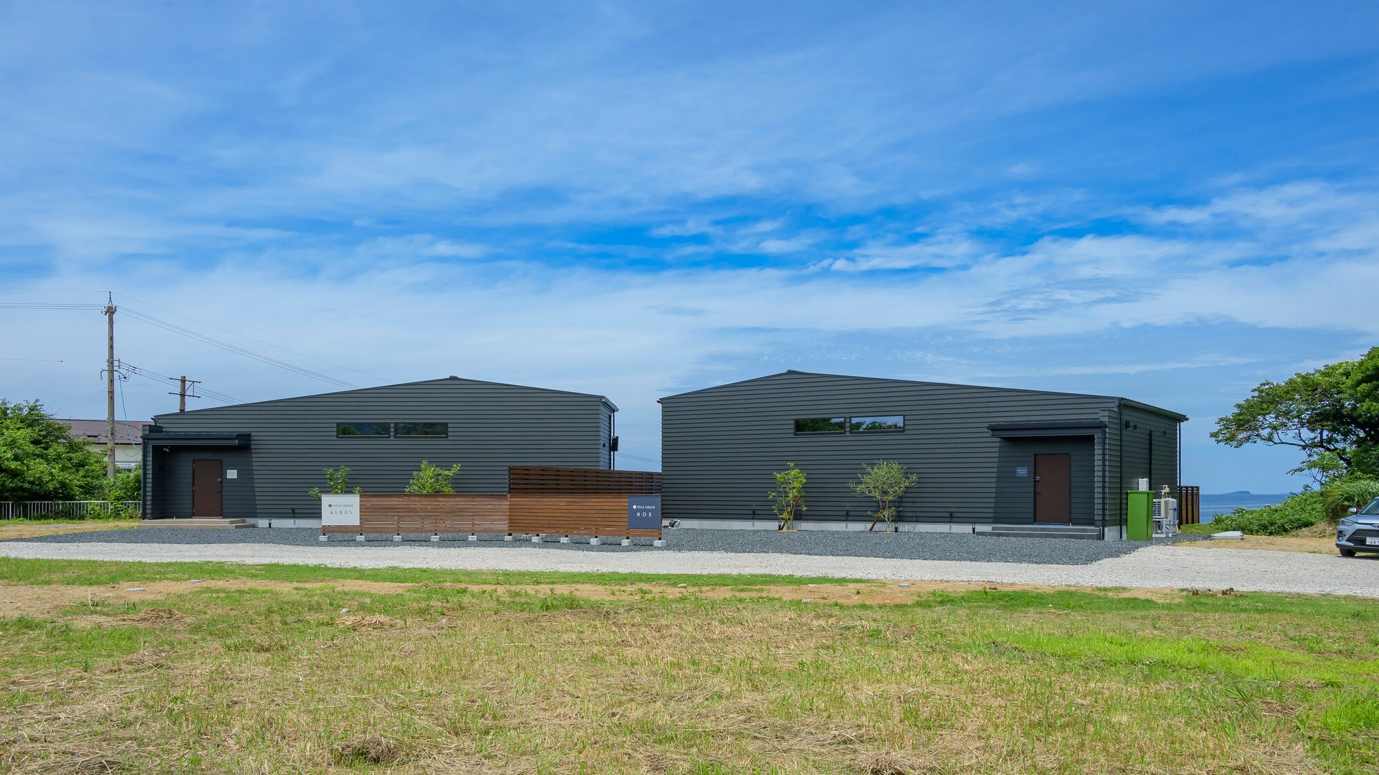 "VILLA" is an extraordinary space. The modern black building creates a striking contrast with the blue sky.